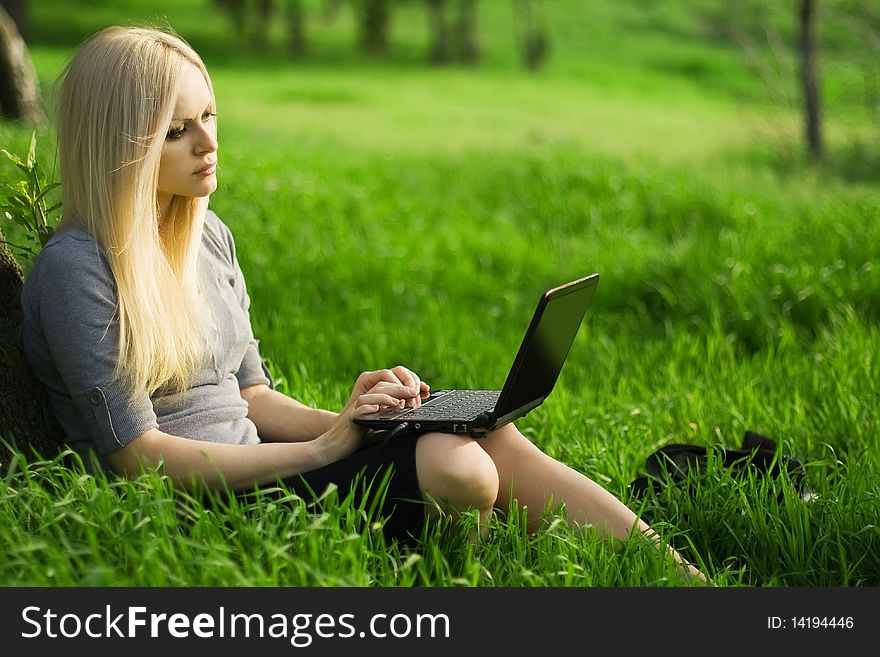 Beautiful Business Woman With The Laptop