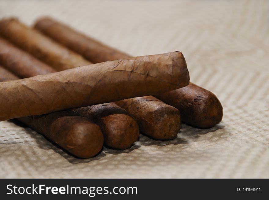 Bunch of typical handmade cuban cigars with soft focus