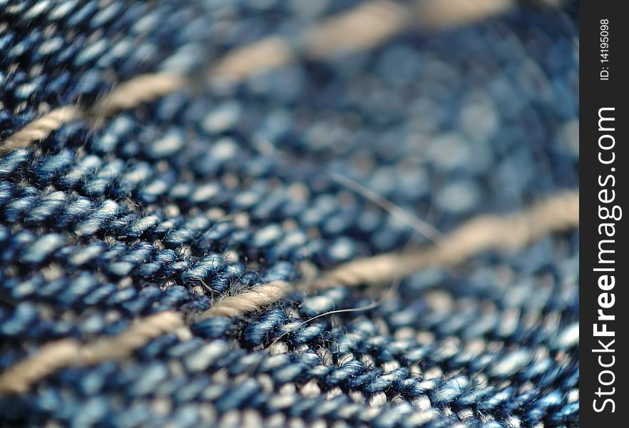 Abstract macro background of a piece of blue denim. Abstract macro background of a piece of blue denim