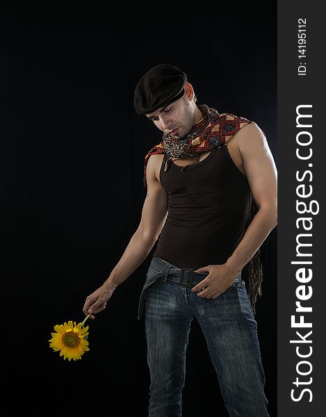 Young man holding sunflower, isolated