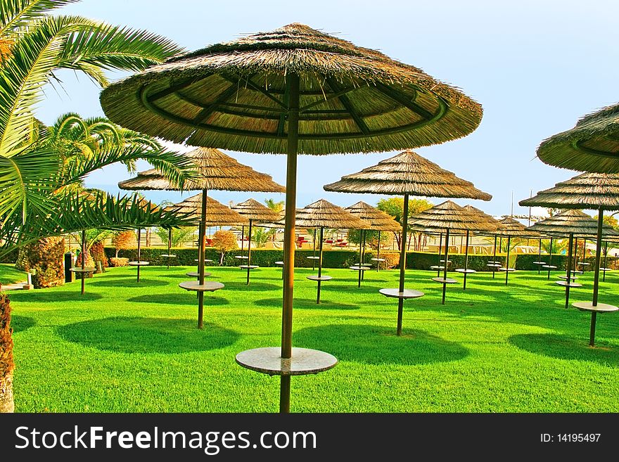 Beach umbrellas in tropics, horizontal picture.