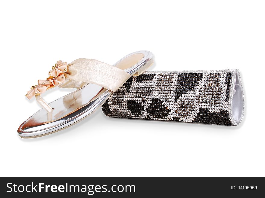 This is a beautiful ladies fancy shoes and clutch purse isolated on a white background. This is a beautiful ladies fancy shoes and clutch purse isolated on a white background.