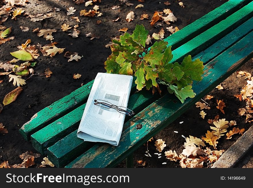 A lonely bench in the autumn park. A lonely bench in the autumn park