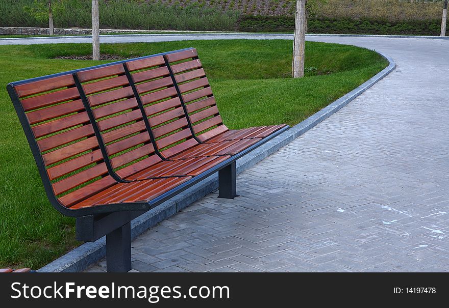 New wooden bench in a city park in Donetsk Ukraine
