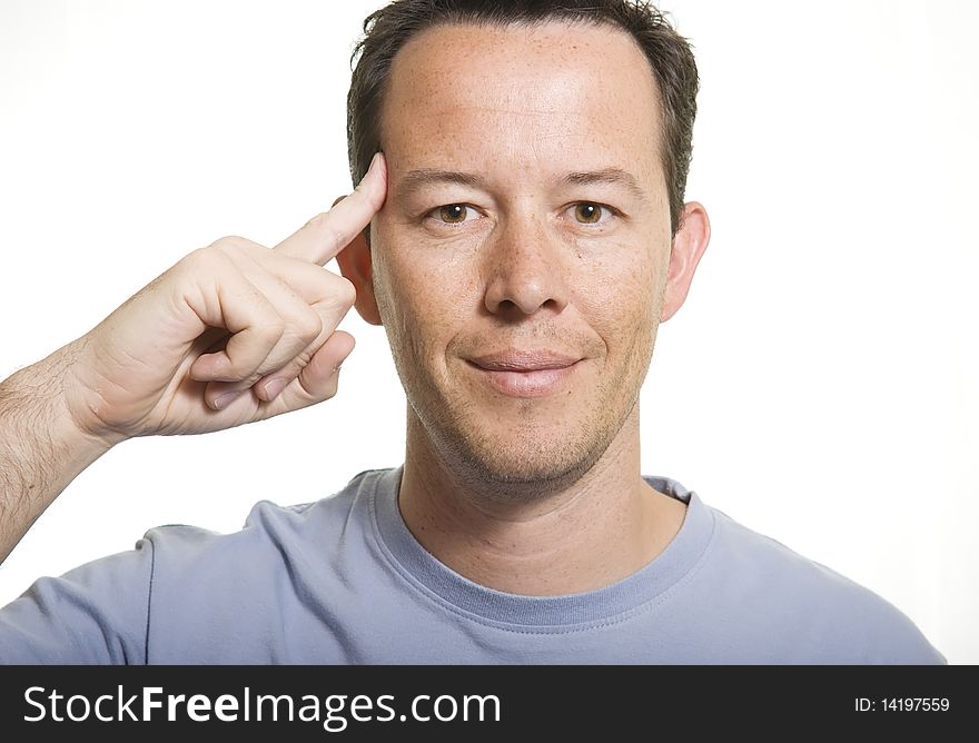 Man pointing his head with a finger. Man pointing his head with a finger