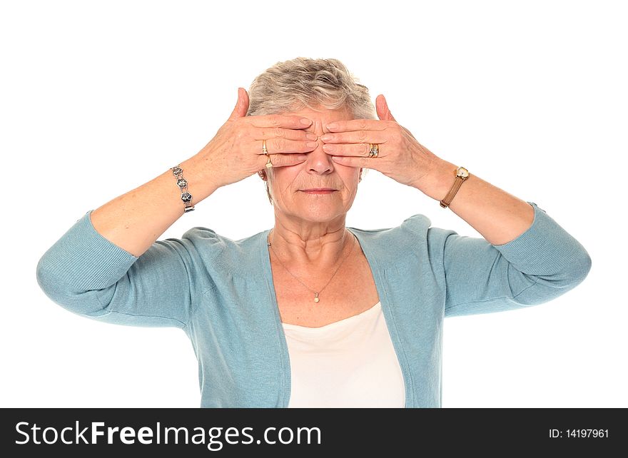 Senior older woman isolated on white covering eyes. Senior older woman isolated on white covering eyes