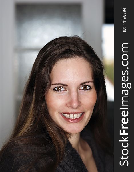 Headshot of a smiling woman at home