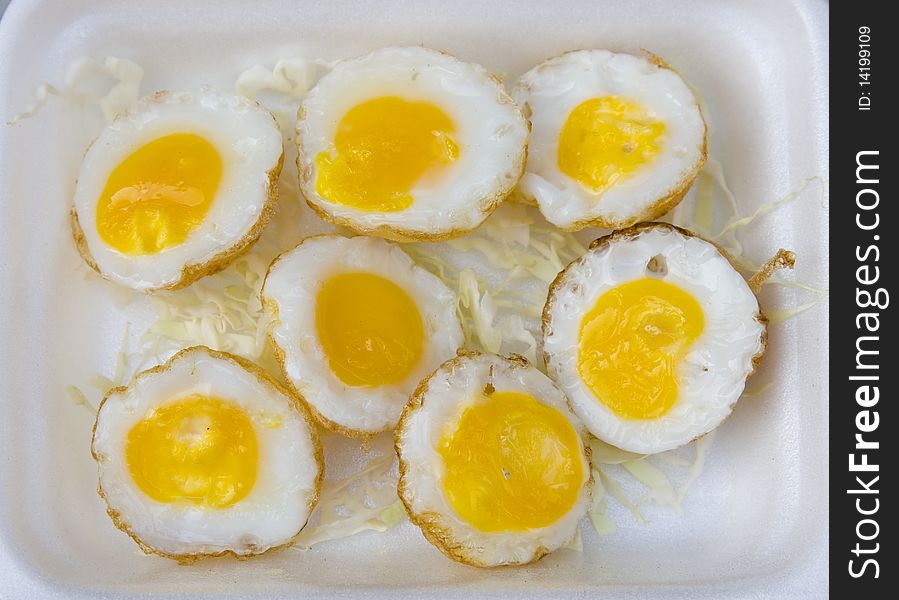 Quail eggs on a white plate