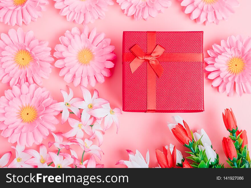 Fower and gift box on pink background with copy space, valentine day concept. Fower and gift box on pink background with copy space, valentine day concept