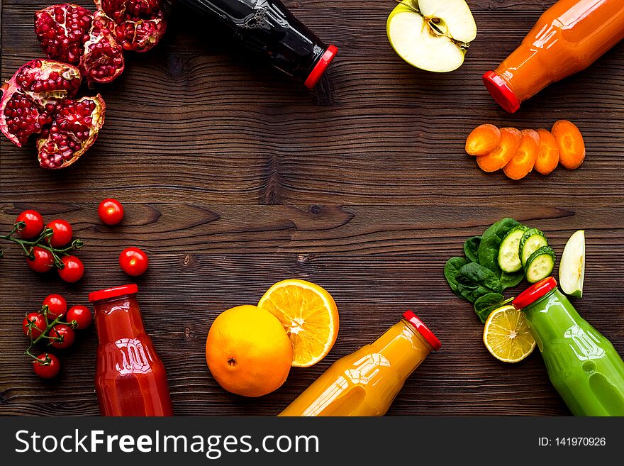 Vegetable and fruit juice in bottles for diet drink on wooden table background top view mock up