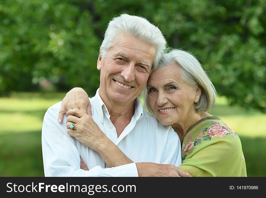 Loving mature couple in a summer park. Loving mature couple in a summer park