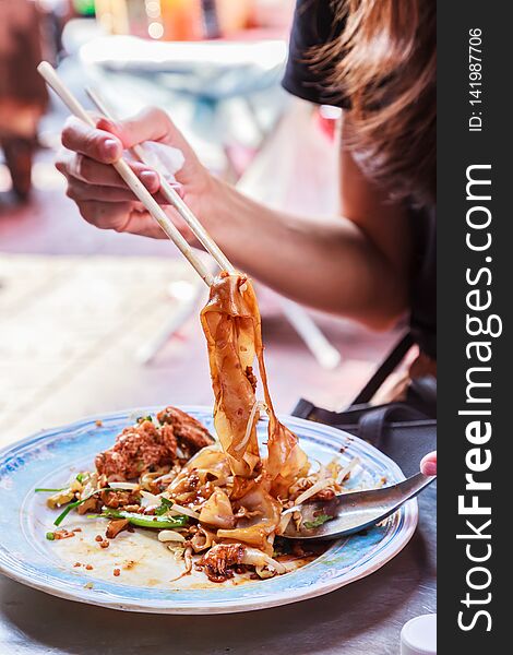 Appetizer dish of traditional Thai street food, Kuay Tiew Lui Suan, Fried Minced Pork and dried shrimp with Noodle Pad served with