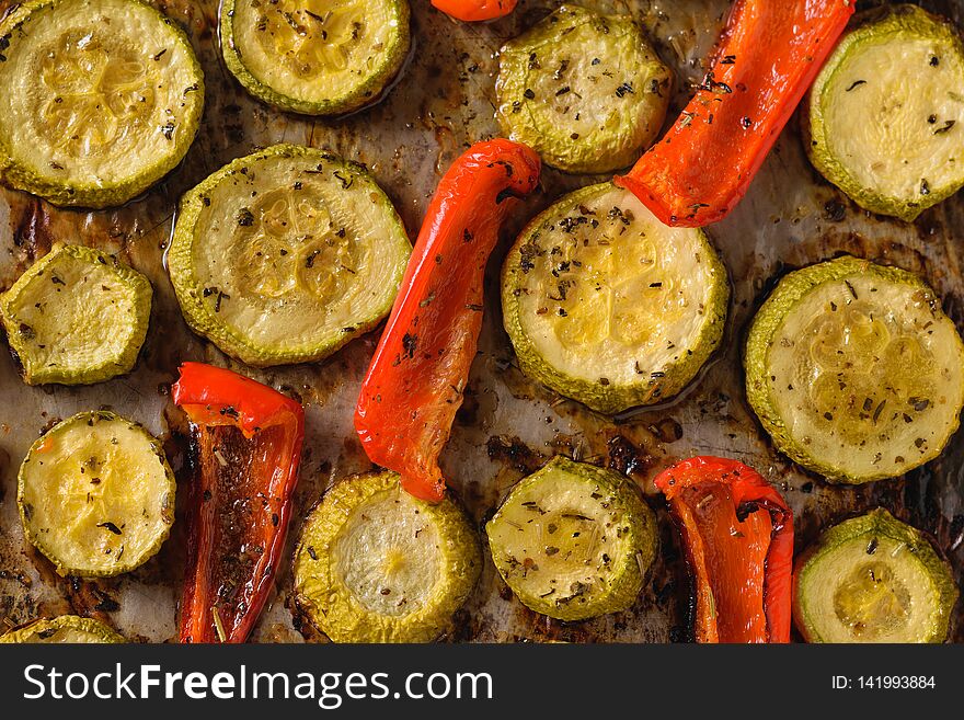 Baked bell peppers and zucchini close-up. Vegetarian dish. Natural plant food. The view from the top. Flat lay