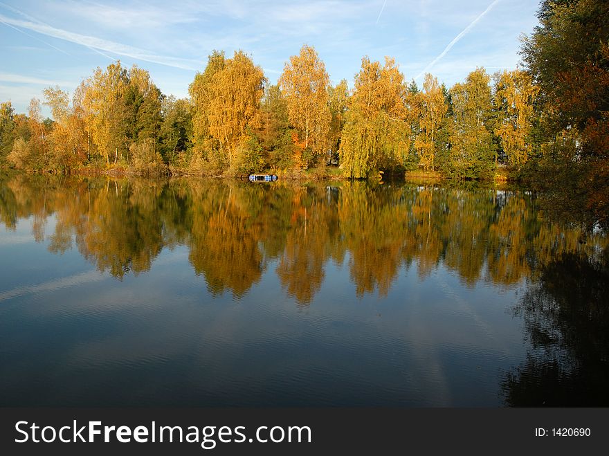 Autumn trees reflecting in a lake in bavaria. Autumn trees reflecting in a lake in bavaria