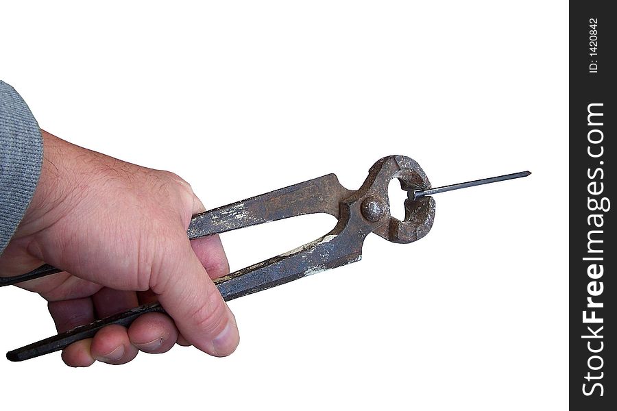 Pinch off a nail with the snips, isolated