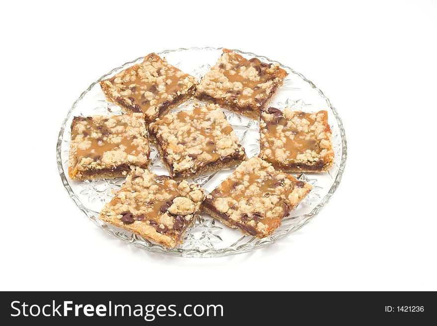 Home-made caramel squares on a crystal serving tray. Home-made caramel squares on a crystal serving tray.