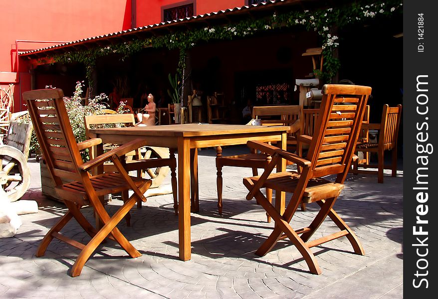 Terrace forniture on wood made. Table and chairs