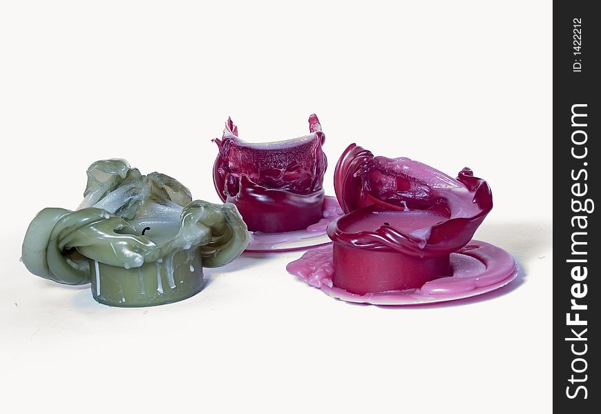 A collection of melted candles creating unique shapes.