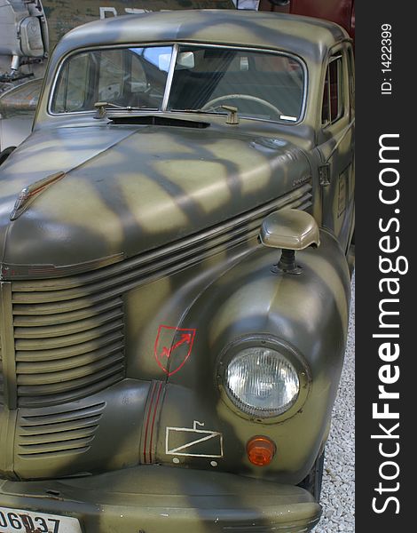 Old second world war army car with a camouflage finish. Old second world war army car with a camouflage finish