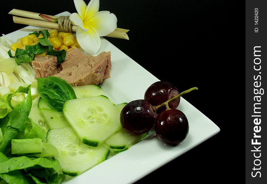 Tuna fish salad on white platter decorated whit flower. Tuna fish salad on white platter decorated whit flower