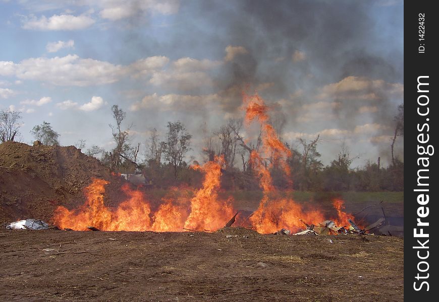 Trash burning in a pit. Trash burning in a pit