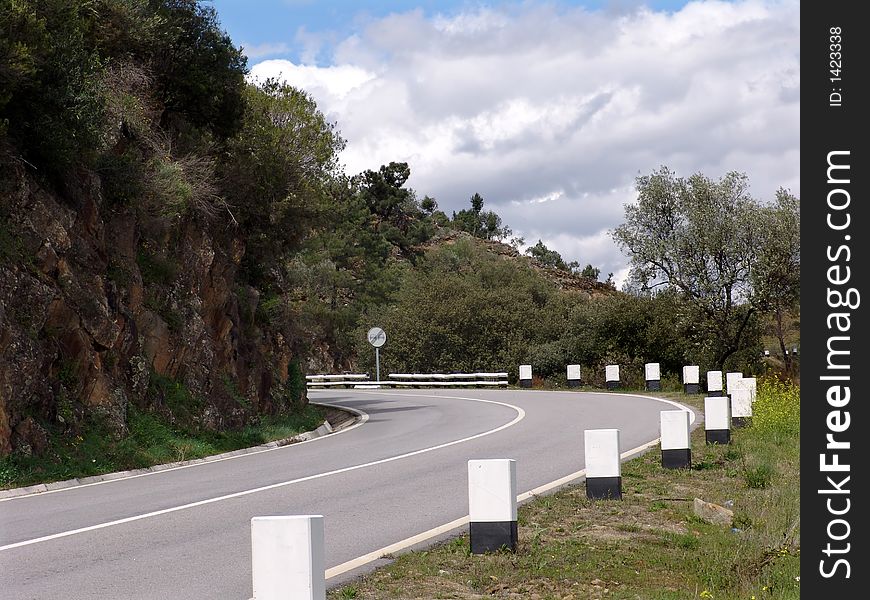 Road in the mountain with blue sky and trees