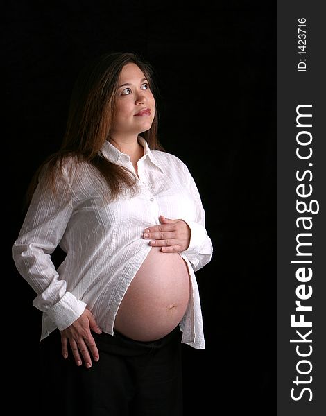 Woman looking right pregnant pensive. Woman looking right pregnant pensive