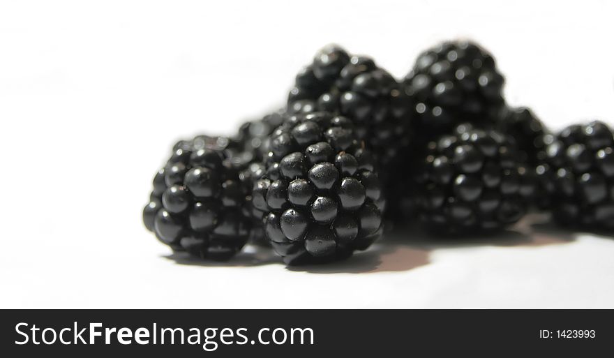 Blackberries close-up on a white background