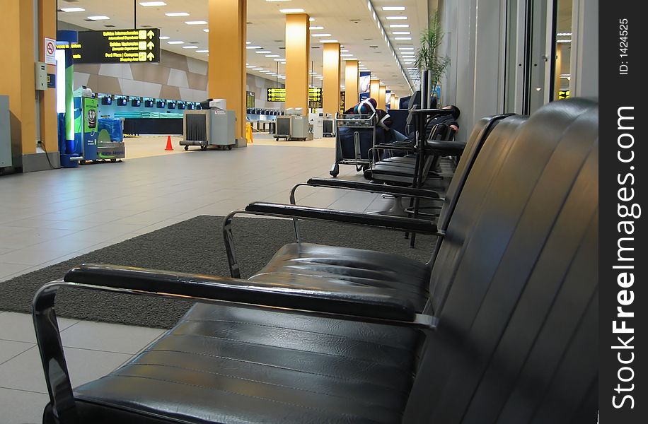 Black arm-chair in airport. Black arm-chair in airport