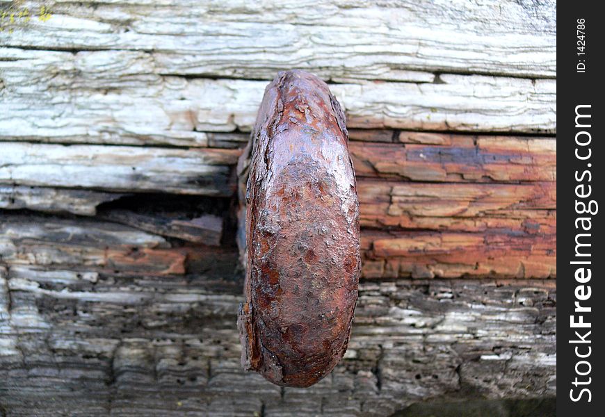 Rusty ring on hartbour wall