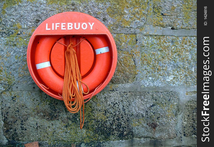 Lifebouy on a harbour wall