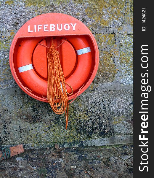 Lifebouy on a harbour wall