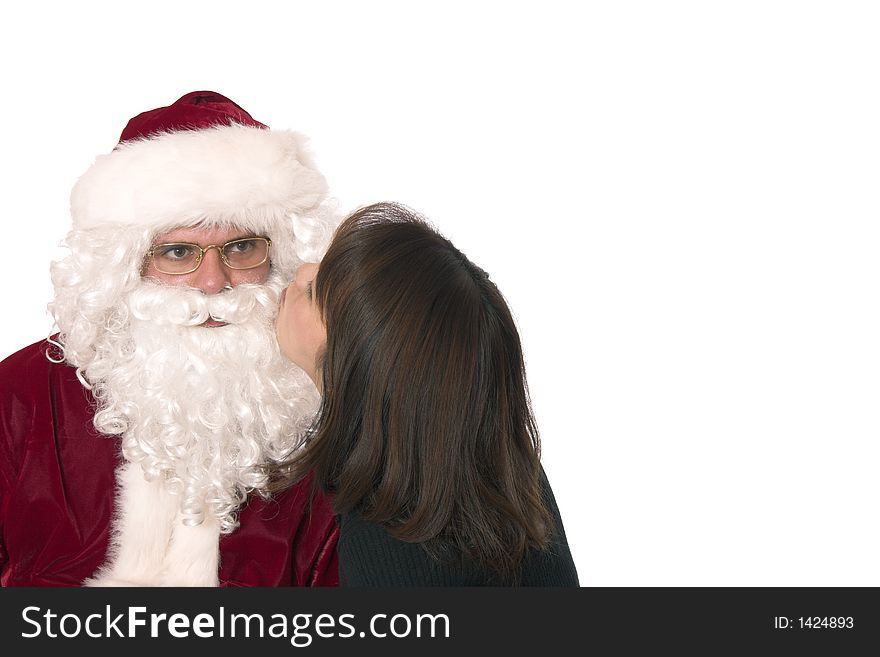 Santa getting a kiss from a cute lady. Santa getting a kiss from a cute lady