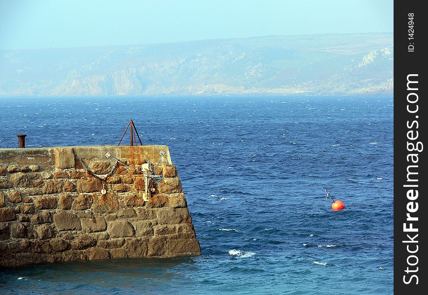 Cornish harbour wall on a sunny day