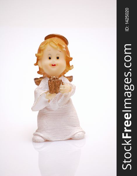 Figurine of an angel with a gift