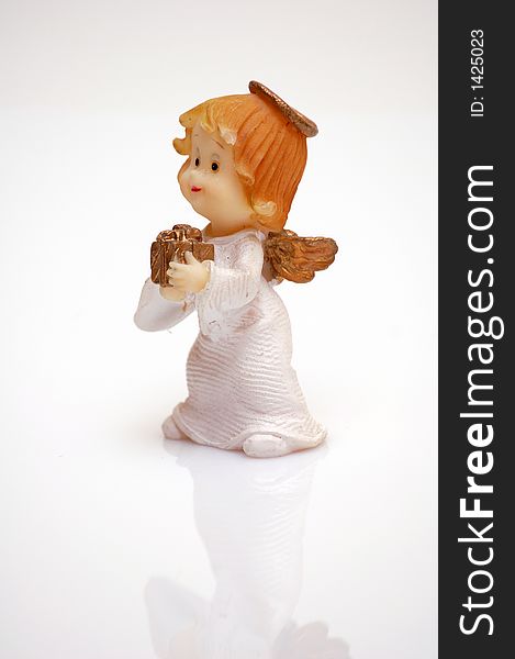 Figurine of an angel with a gift