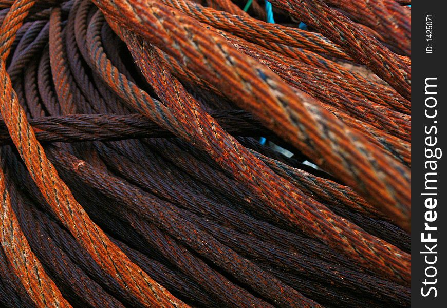 Rusty steel rope in in harbour