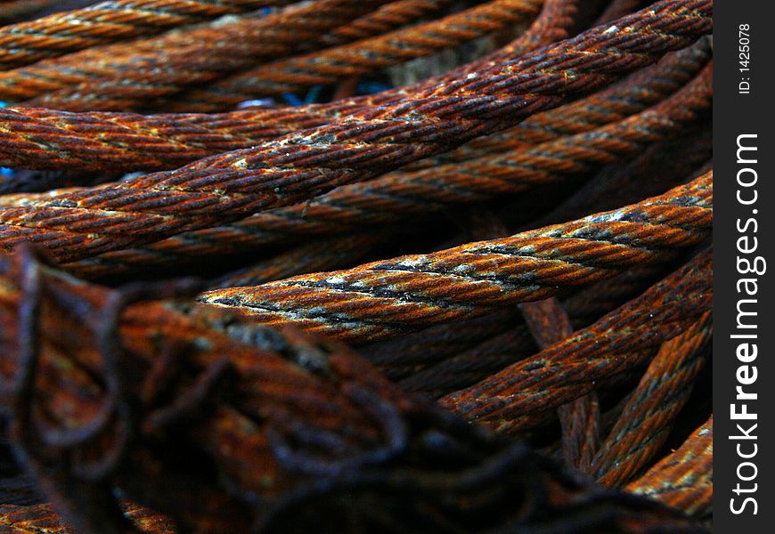 Rusty steel rope in in harbour