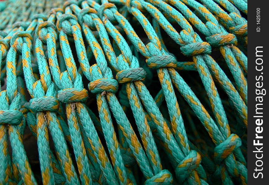 Green fishing nets in harbour