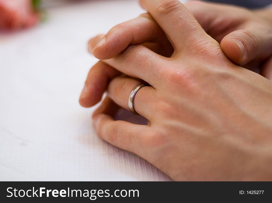 Groom's hands sporting a new wedding band. Groom's hands sporting a new wedding band