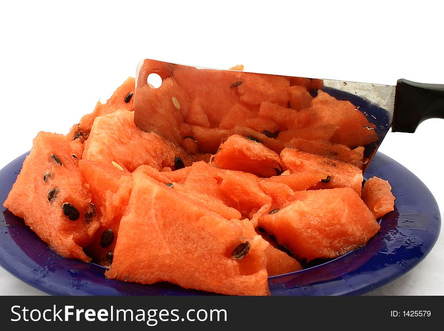 Fragment watermelon on the plate with cleaver. Fragment watermelon on the plate with cleaver