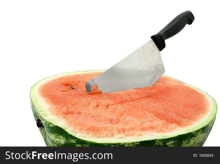 Fresh half of watermelon with cleaver
