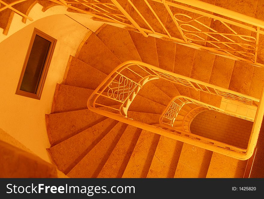 Stair in a building orange light