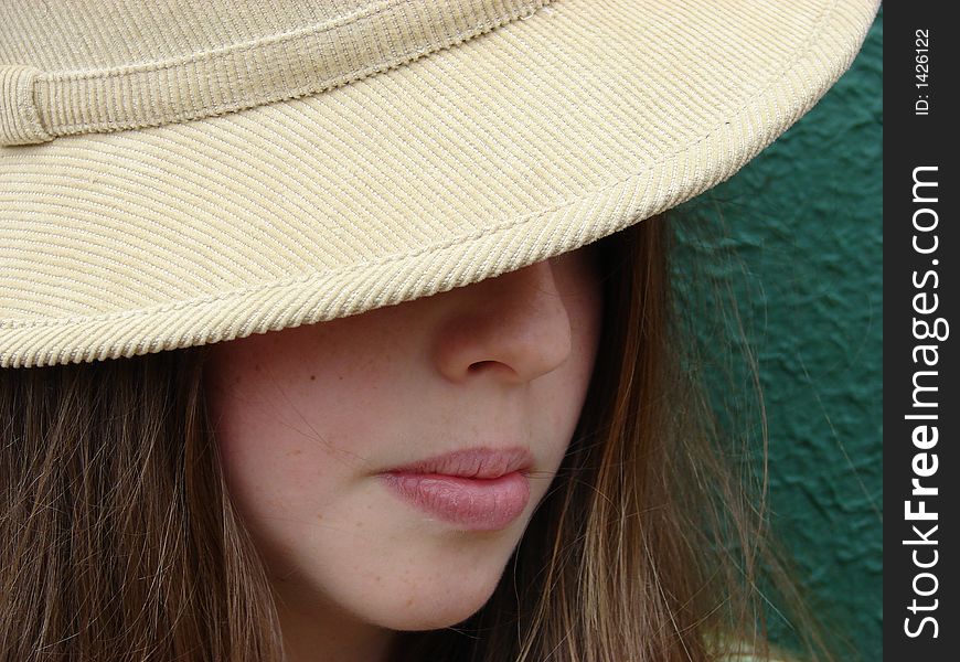 Young girl with a camel coloured hat. Young girl with a camel coloured hat.