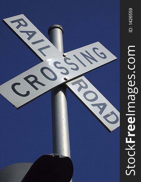 Close up shot of a train railroad crossing sign.