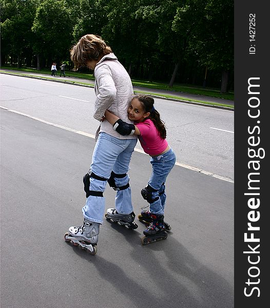 Mother and daughter on rollers.