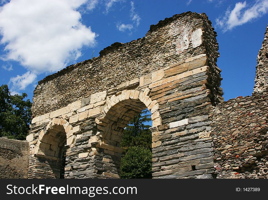 An ancient roman aqueduct that were used to transport water from one city to another. An ancient roman aqueduct that were used to transport water from one city to another.