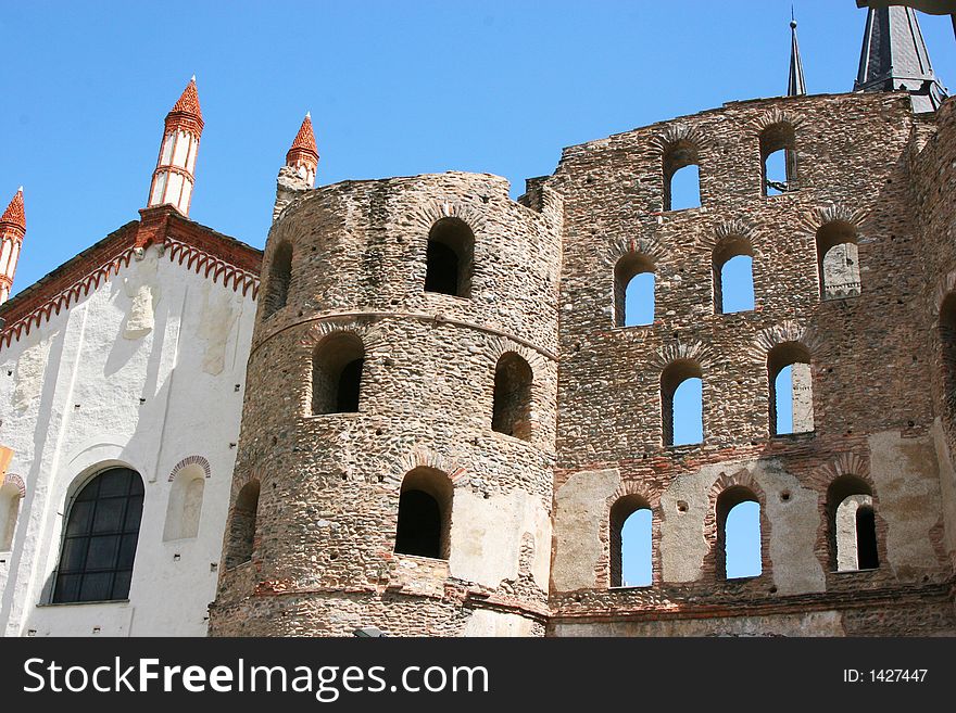 An ancient roman monument in a city in Italy. An ancient roman monument in a city in Italy.