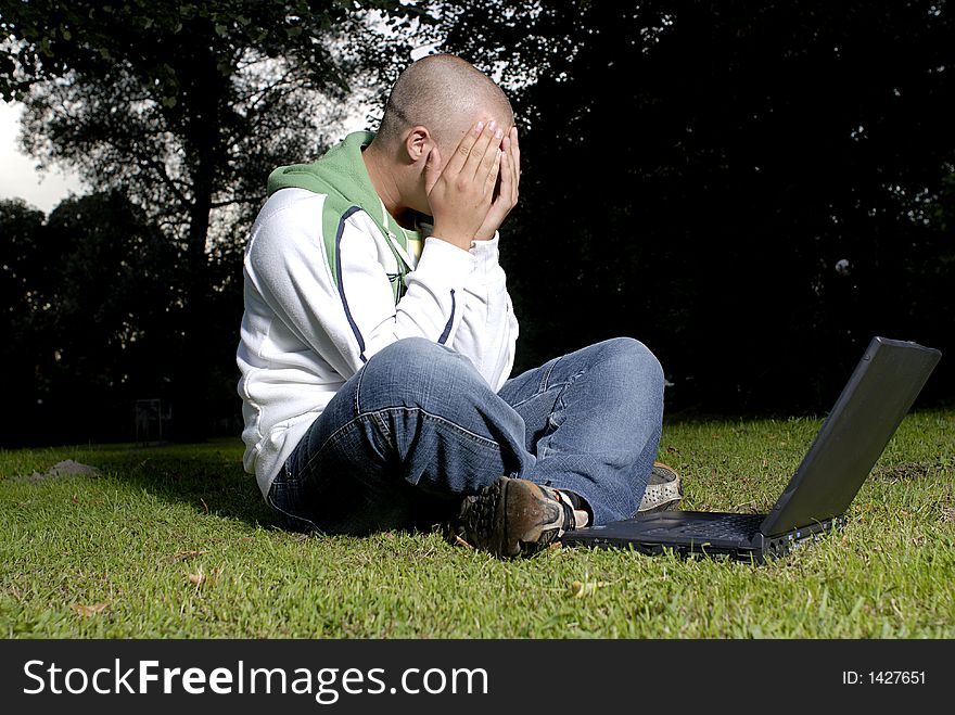 Boy With Notebook In Park