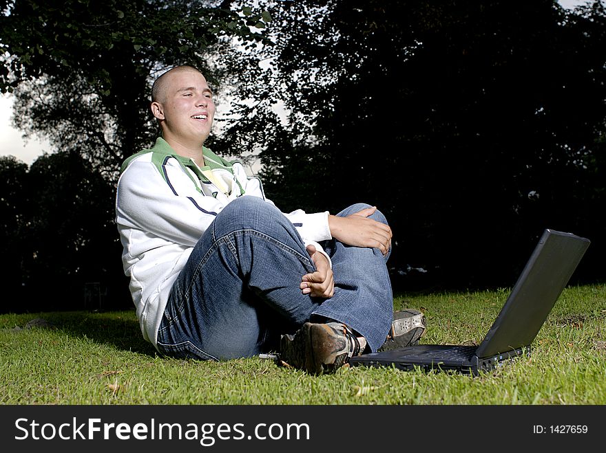 Boy With Notebook In Park